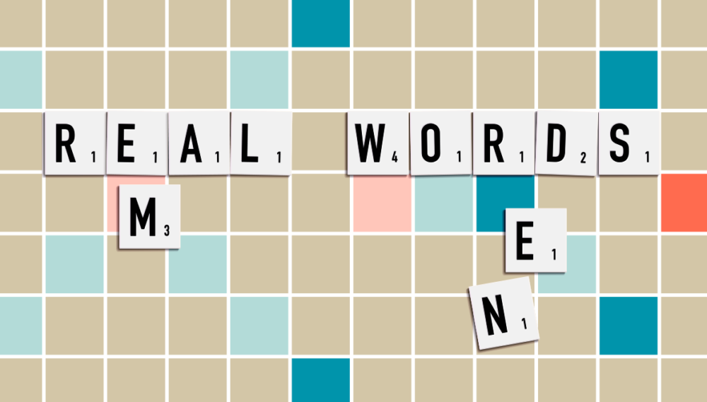 Scrabble board with the blocks spelling out Em and En