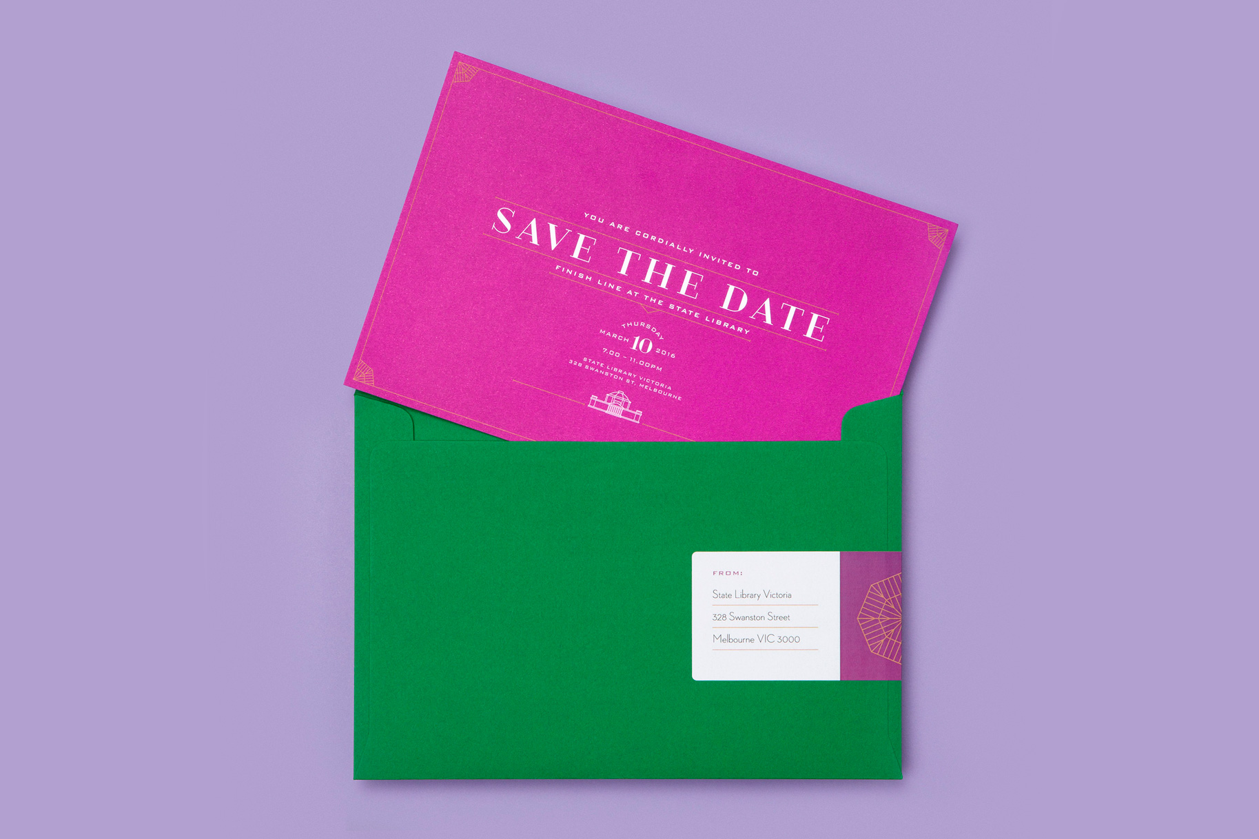 Finish Line magenta-coloured invitation, sitting on a racing-green envelope