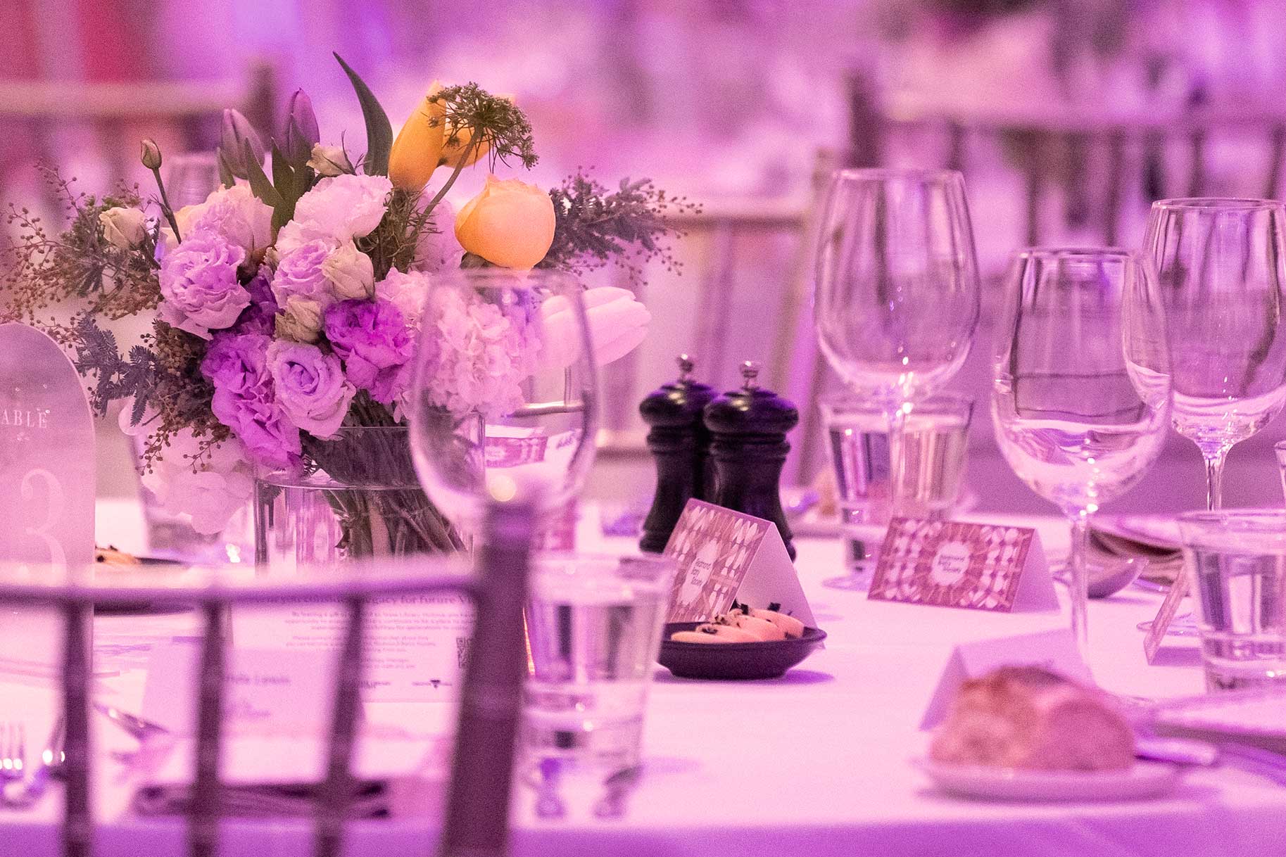 Redmond Barry Society event at State Library Victoria - dinner setting showing donation cards amongst glasses and food items